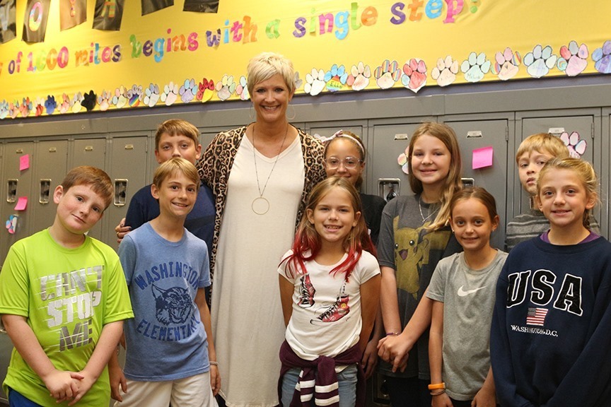 Cheri Desoto, winner of the Presidential Award for Excellence in Mathematics and Science Teaching, poses with some of her students.