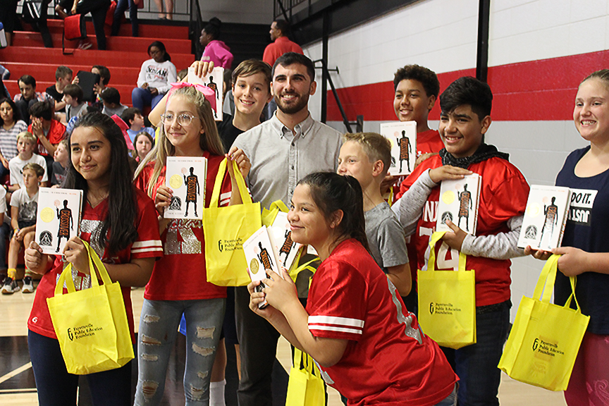Students at Ramay and Woodland Jr. High Schools received a copy of “The Crossover,"  a book by national award-winning author Kwame Alexander.