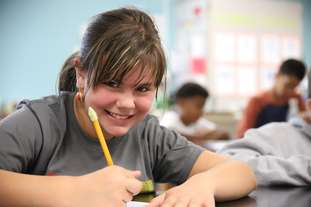 Picture of FPS students busy at work with great smile and pencil in hand.